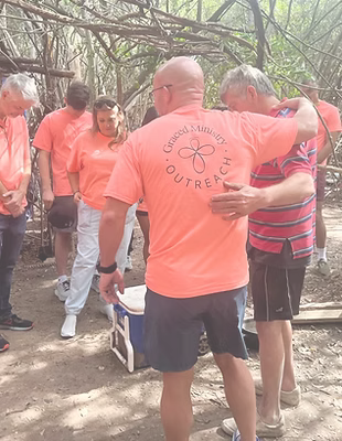 Praying over the homeless